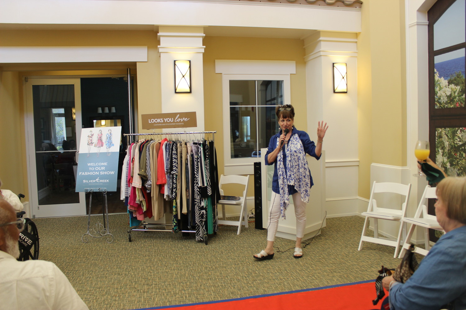 Chico’s Ponte Vedra Assistant Manager Linda Fazio addresses the attendees of the fashion show.